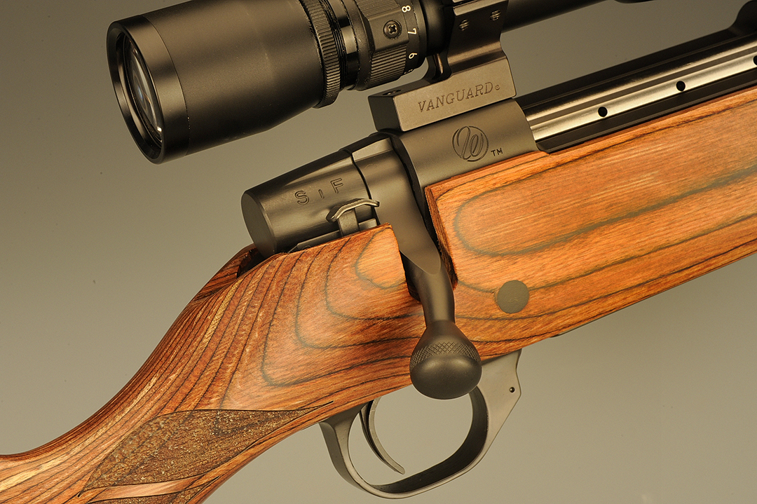 Keeping up with modern times, this gun comes with a 3-position safety as explained in the feature. The total action is polished and blued and the bolt knob has a single ring of checkering around its periphery.